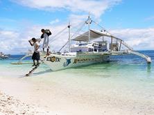 Philippines Scuba Diving Holiday. Malapascua Dive Boat Unloading.